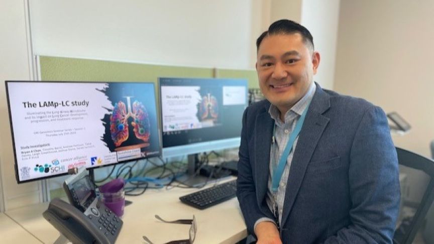 A/Prof. Chan sits at his desk.