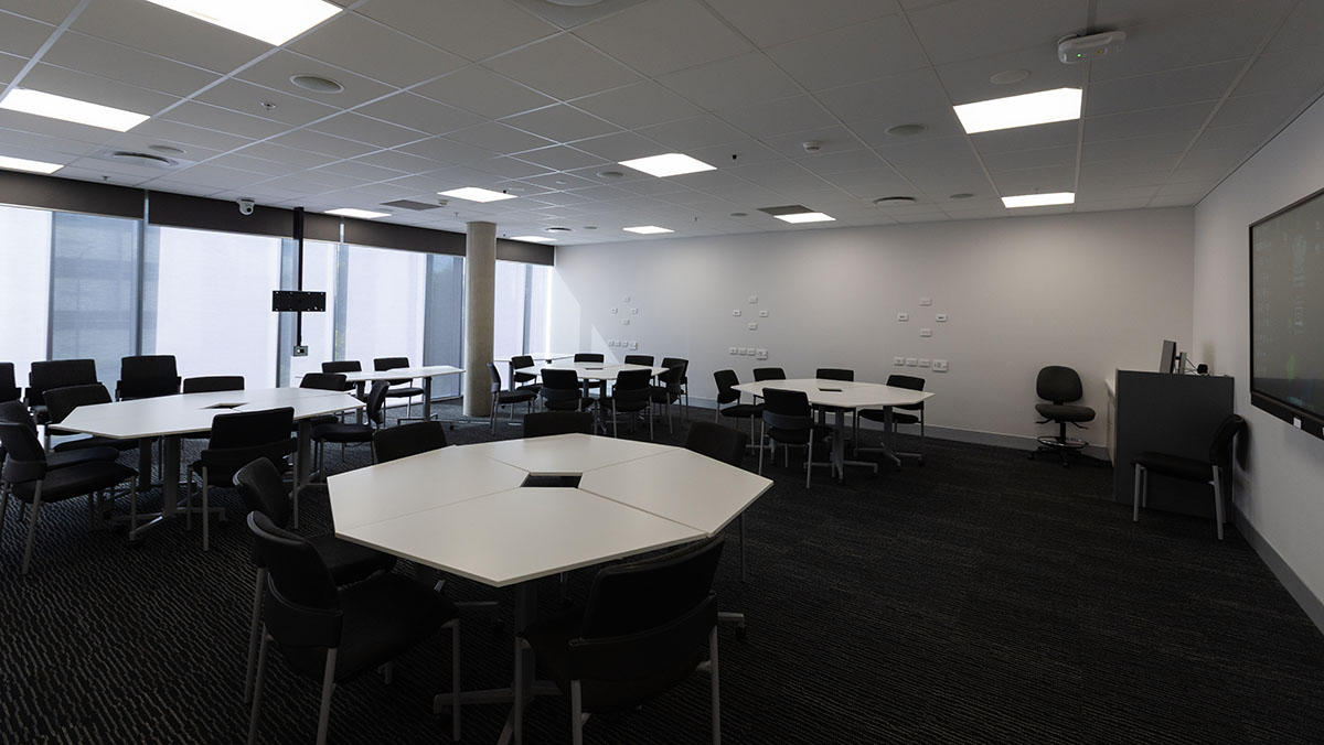 tables and chairs with screens for training