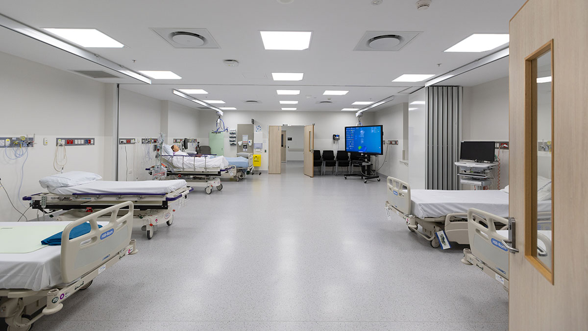 Clinical training room with beds and medical equipment