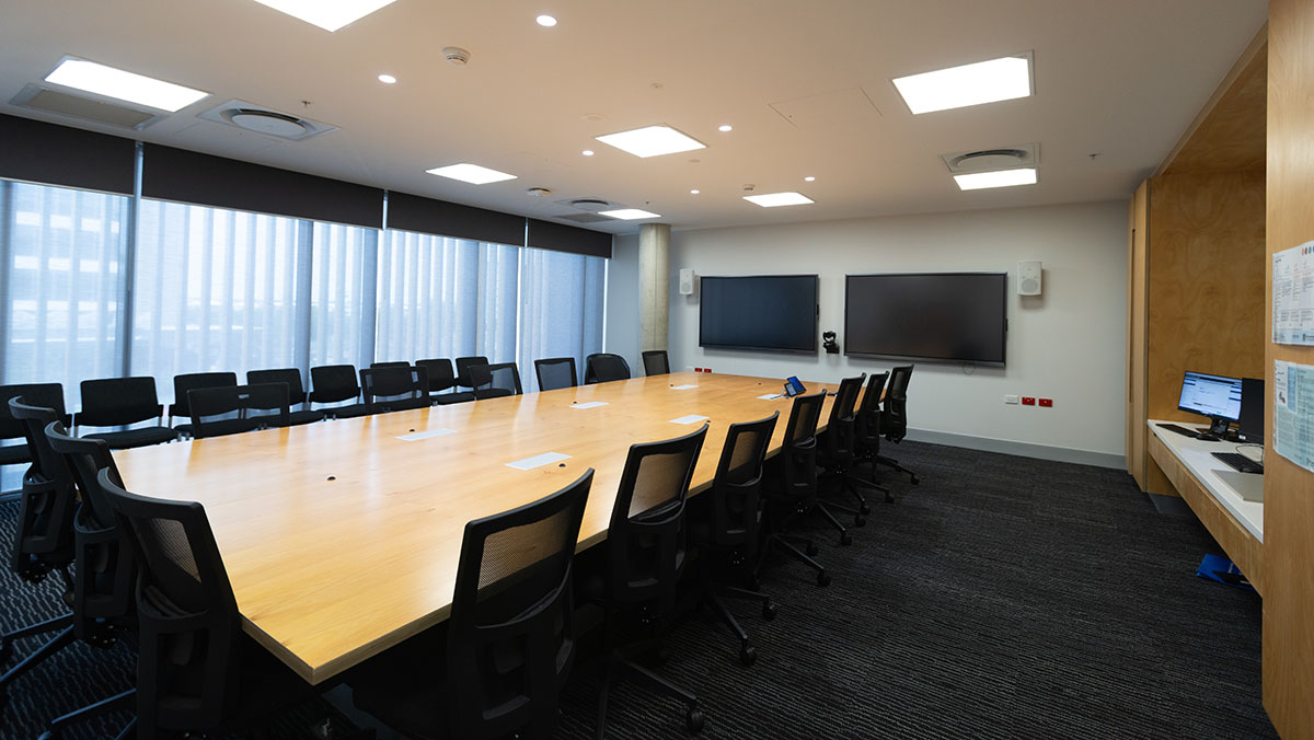 Empty boardroom with table and chairs