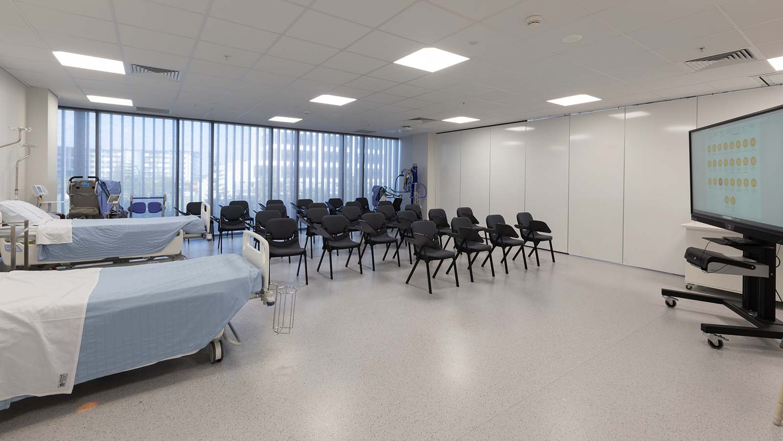 Clinical room with chairs and medical beds